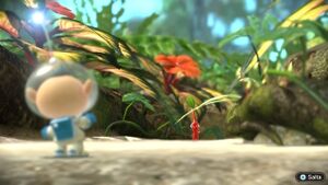 Alph-con-Pikmin-rosso.jpg